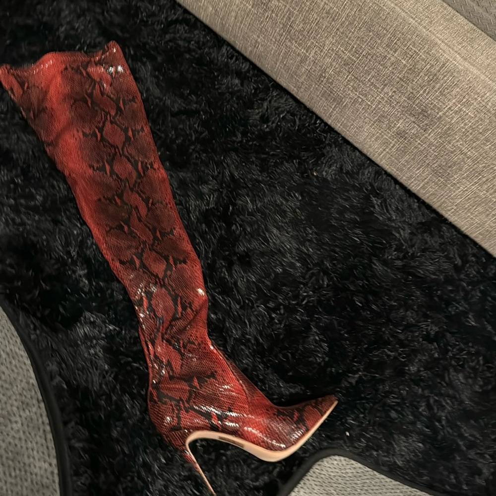 Snake skinned and black over the knee heels